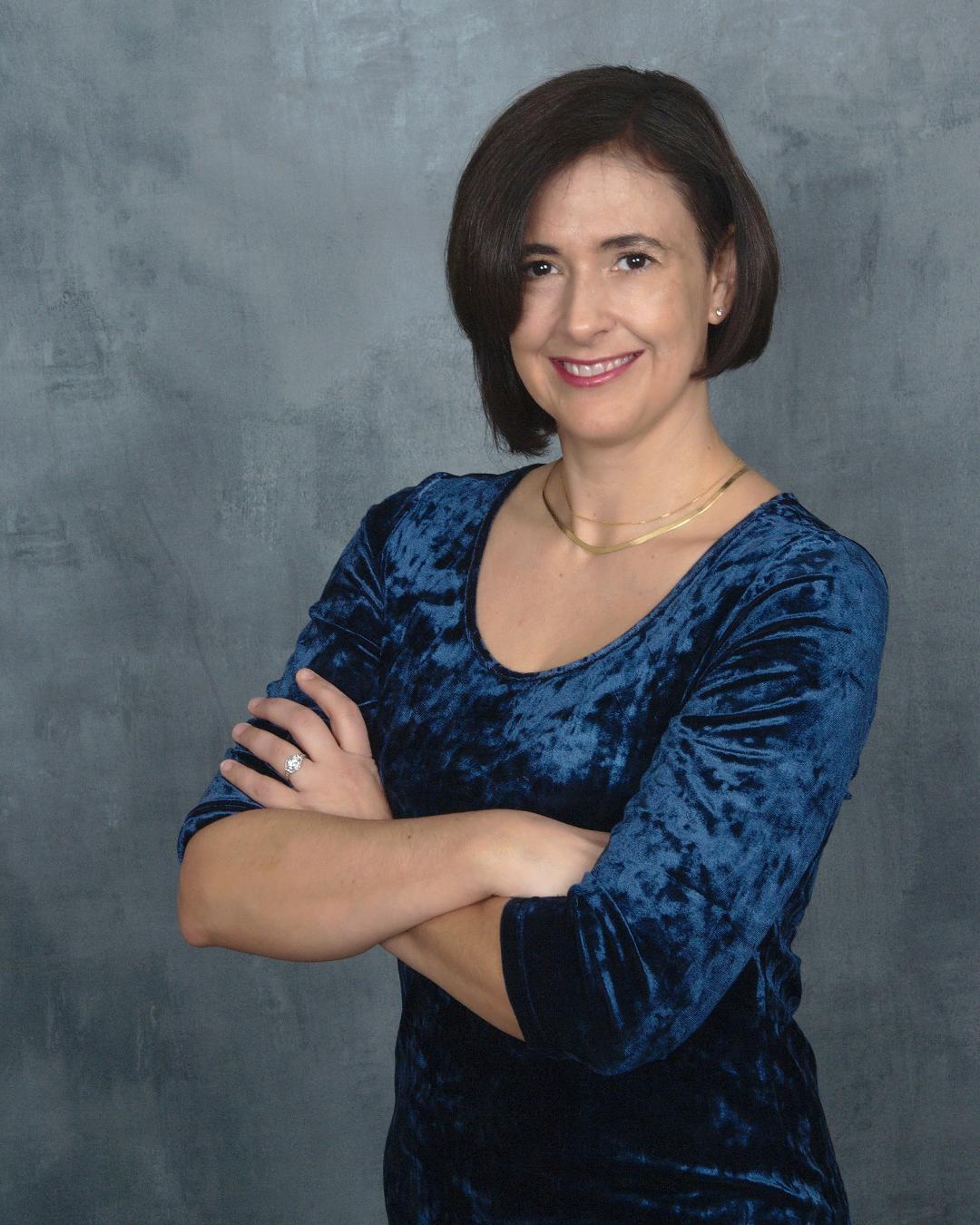 Professional headshot of Dr. Maria E. Johnson